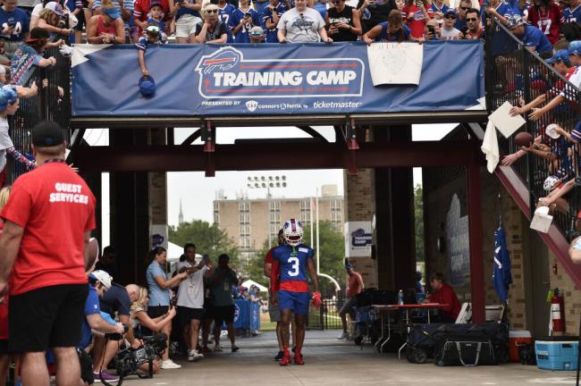 Buffalo Bills safety Damar Hamlin (3) walks to the field before practice at the NFL football team's training camp in Pittsford, N.Y., Wednesday, July 26, 2023. (AP Photo/Adrian Kraus)