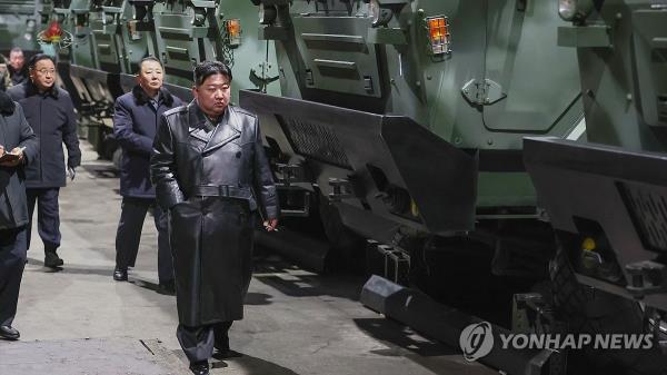 North Korean leader Kim Jong-un (C) inspects a munitions factory, in this undated photo captured from the North's Korean Central Television on Jan. 10, 2024. During his visits to major munitions factories in unspecified locations on Jan. 8-9, Kim called South Korea the country's