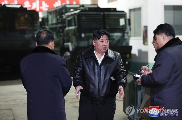 This photo, carried by North Korea's official Korean Central News Agency on Jan. 10, 2024, shows the North's leader Kim Jong-un (C) at a key munitions factory during an inspection tour on Jan. 8-9, calling South Korea the North's