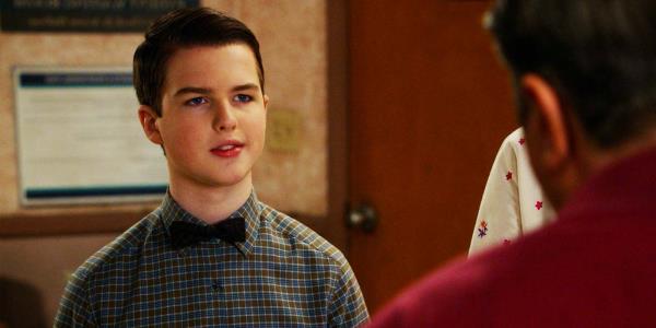 Iain Armitage as Sheldon Cooper and Lance Barber as George Cooper in Young Sheldon season 6