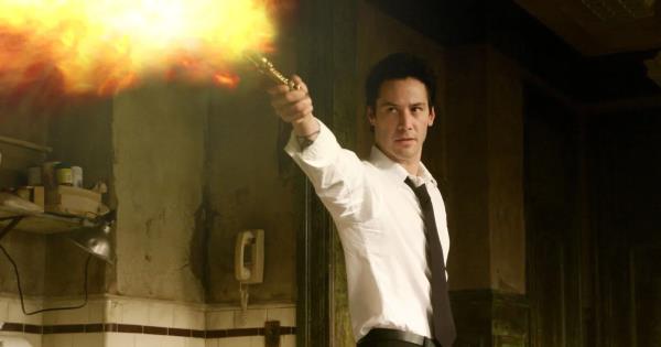 Keanu Reeves shooting a blast of fire in Constantine.