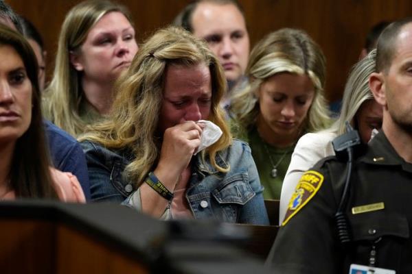 Sheri Myre, mother of slain Oxford student Tate Myre, weeps in court as the assistant principal at the school describes the shooting scene on Friday in Pontiac, Mich.