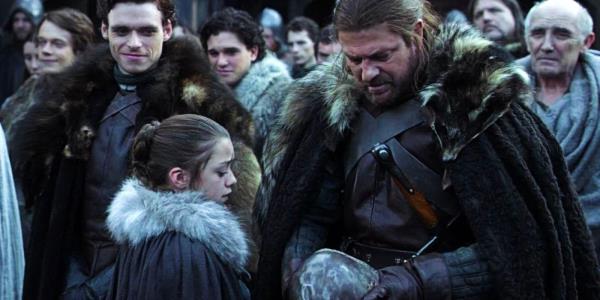 Arya (Maisie Williams) and Ned Stark (Ned Stark) Standing in a Crowd in Game of Thrones