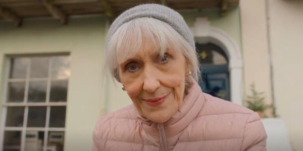 Mrs Flood looking at the camera smiling in Doctor Who 2023 Christmas special The Church on Ruby Road.