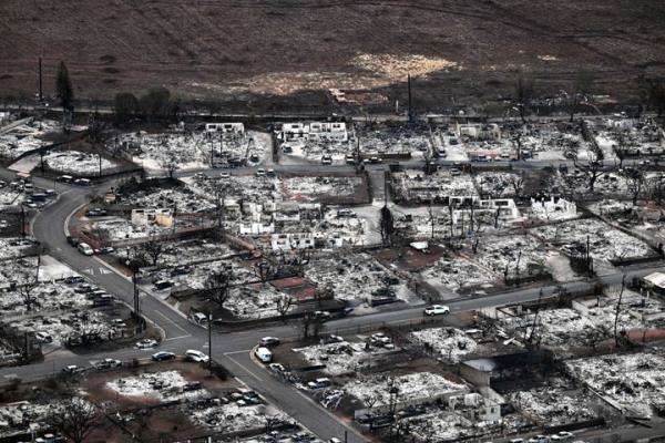 An aerial image taken on August 10, 2023 shows destroyed homes and buildings burned to the ground in Lahaina in the aftermath of wildfires in western Maui, Hawaii. At least 36 people have died after a fast-moving wildfire turned Lahaina to ashes, officials said August 9, 2023 as visitors asked to leave the island of Maui found themselves stranded at the airport. The fires began burning early August 8, scorching thousands of acres and putting homes, businesses and 35,000 lives at risk on Maui, the Hawaii Emergency Management Agency said in a statement. (Photo by Patrick T. Fallon / AFP) (Photo by PATRICK T. FALLON/AFP via Getty Images)