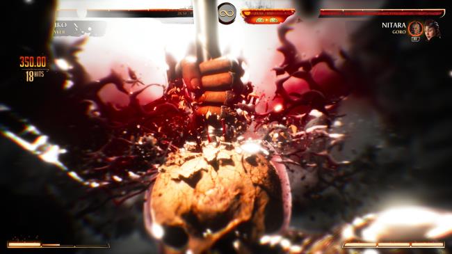 Reiko impaling part of a spear into Nitara's skull.